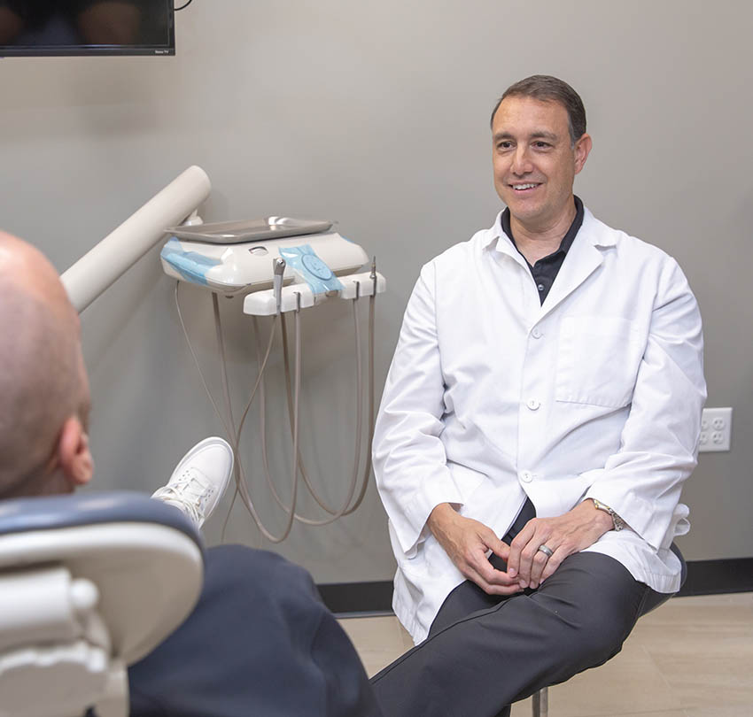 Dr. John Montoya with a patient at Boulder Dental Design